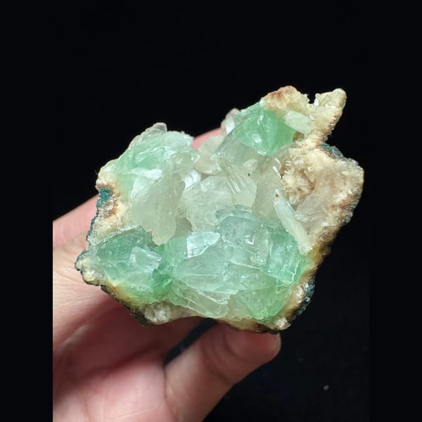 Green apophyllite with pink zeolite from India — detail view