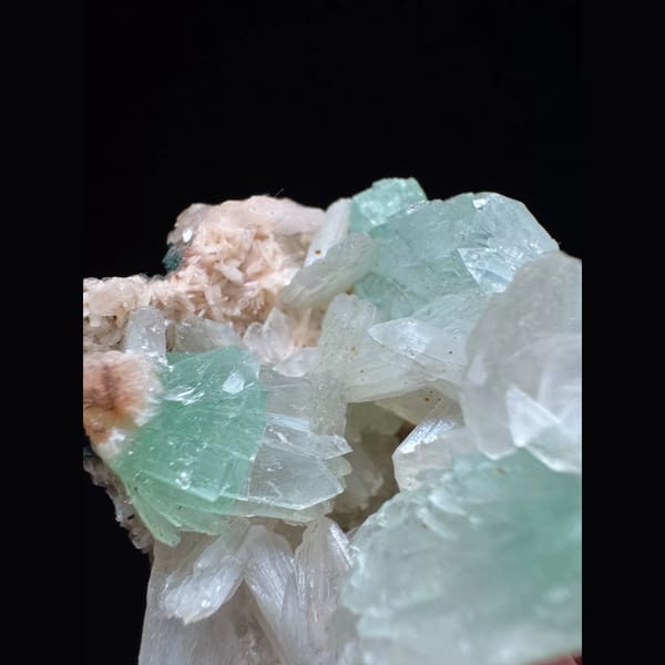 Green apophyllite with pink zeolite from India — detail view