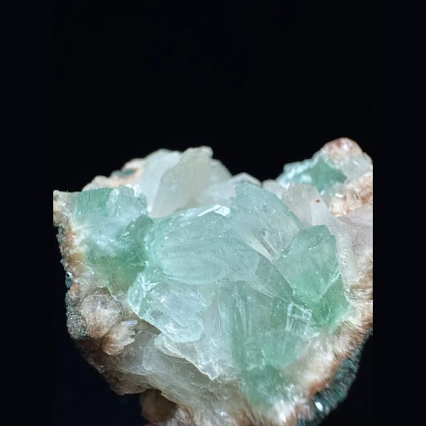Green apophyllite with pink zeolite from India — detail view