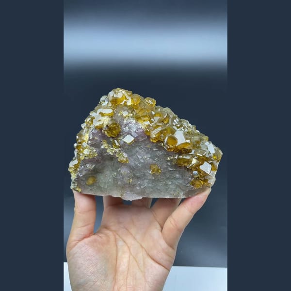 Golden-brown bladed barite crystals over fluorite from Jiangxi — complete view