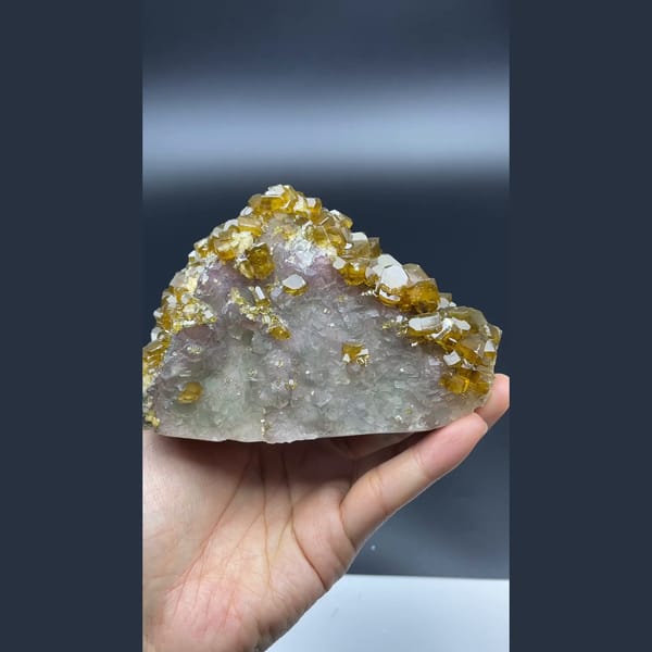 Golden-brown bladed barite crystals over fluorite from Jiangxi — detail view