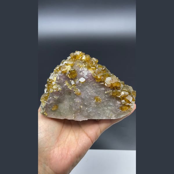 Golden-brown bladed barite crystals over fluorite from Jiangxi — detail view