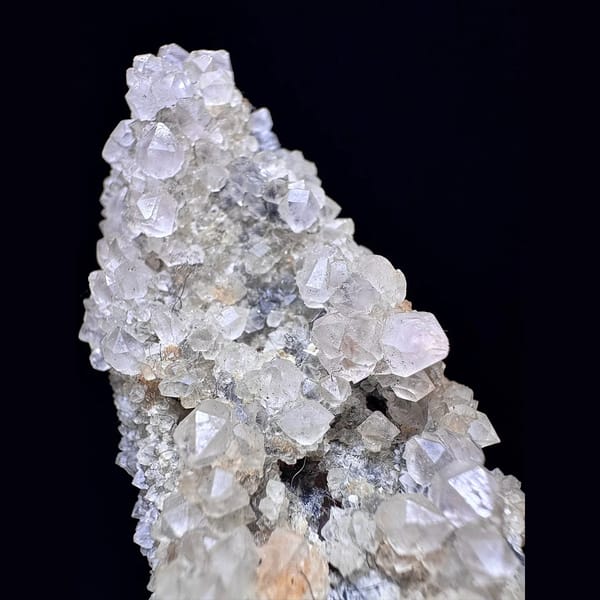 Tall quartz with secondary amethyst and hematite from Inner Mongolia — detail view