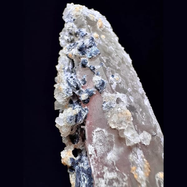Tall quartz with secondary amethyst and hematite from Inner Mongolia — detail view
