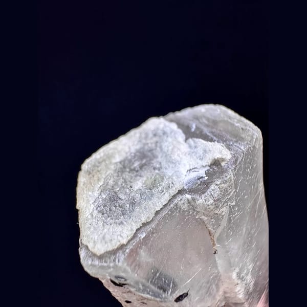 Tall quartz with secondary amethyst and hematite from Inner Mongolia — detail view