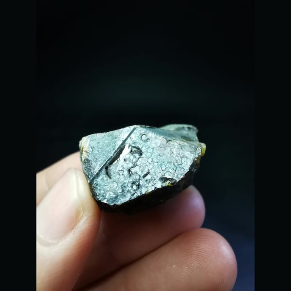 Sphalerite crystal from Inner Mongolia glowing orange when backlit — detail view