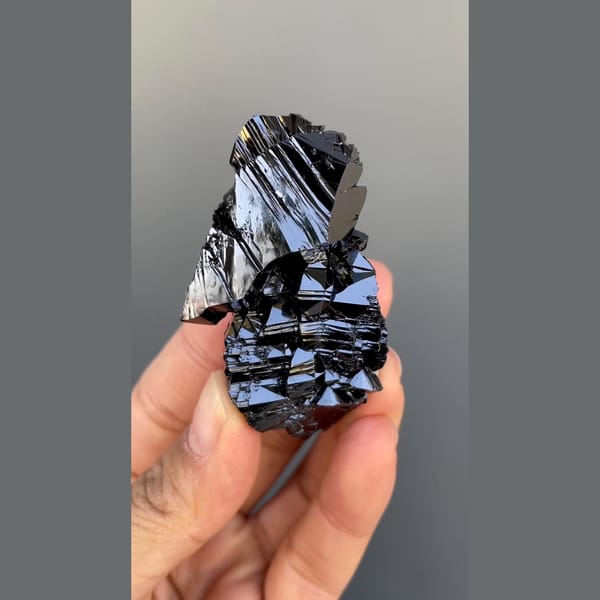 Large group of lustrous black cassiterite from Xuebaoding, Sichuan — complete view