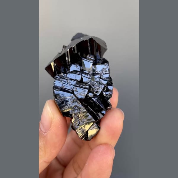 Large group of lustrous black cassiterite from Xuebaoding, Sichuan — alternate view