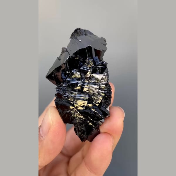 Large group of lustrous black cassiterite from Xuebaoding, Sichuan — alternate view