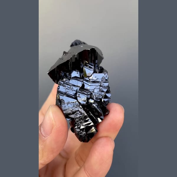 Large group of lustrous black cassiterite from Xuebaoding, Sichuan — detail view
