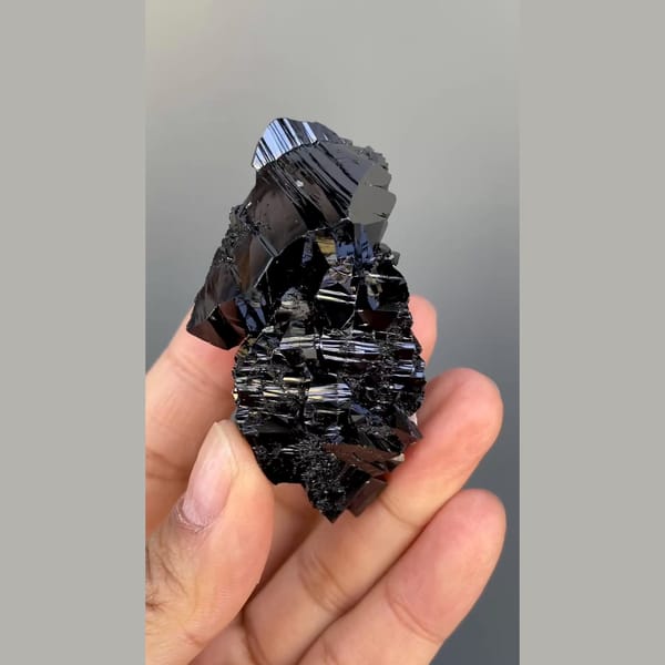 Large group of lustrous black cassiterite from Xuebaoding, Sichuan — detail view