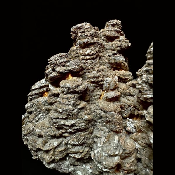 Dark brown layered calcite with quartz from Inner Mongolia — detail view