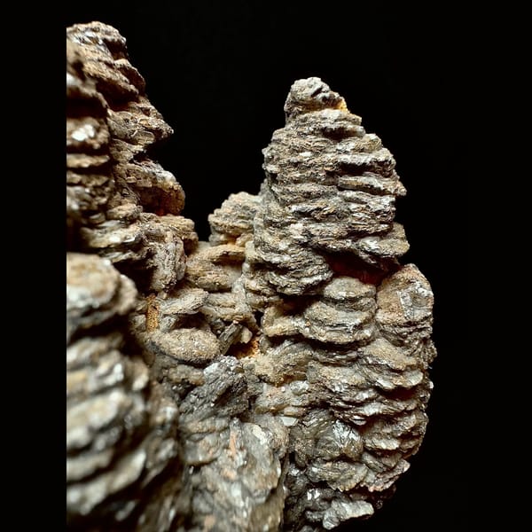 Dark brown layered calcite with quartz from Inner Mongolia — detail view