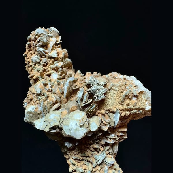 Mud-coated quartz floater with petal calcite from Inner Mongolia — alternate view