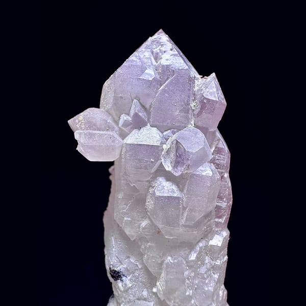 Amethyst castle quartz floater with calcite balls from Inner Mongolia — detail view