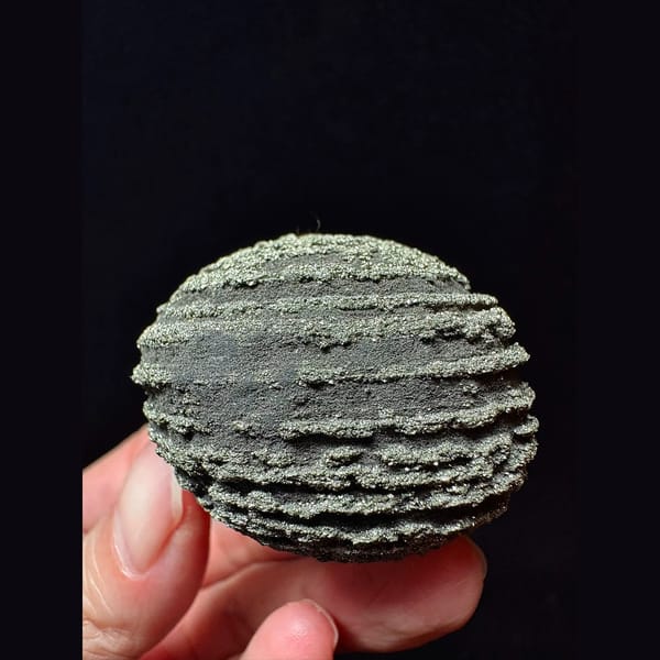 Ridged iron concretion ball from Yunnan — detail view