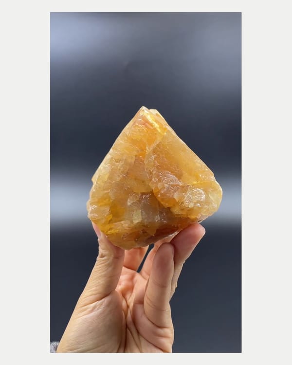 Complete front view of large orange scheelite crystal