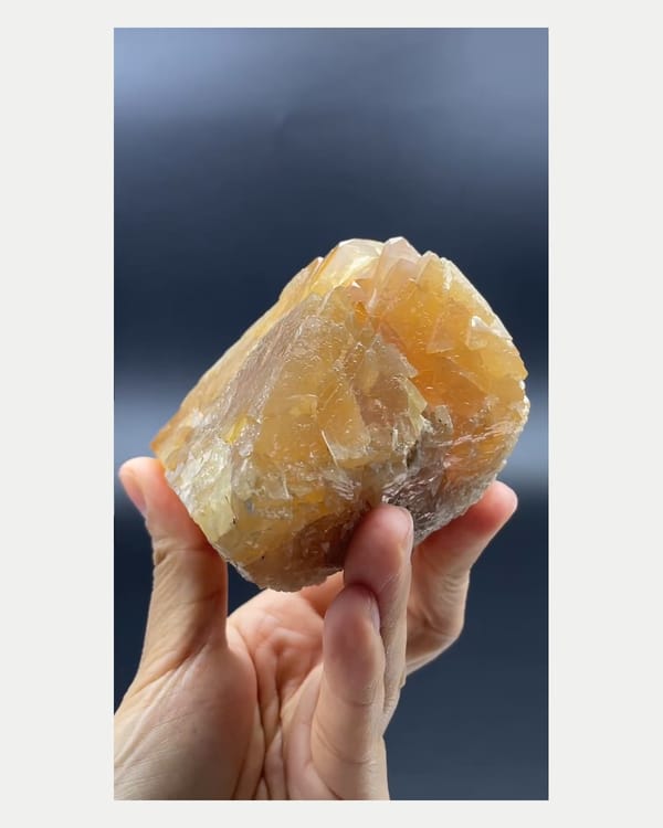 Complete left oblique view of large orange scheelite crystal