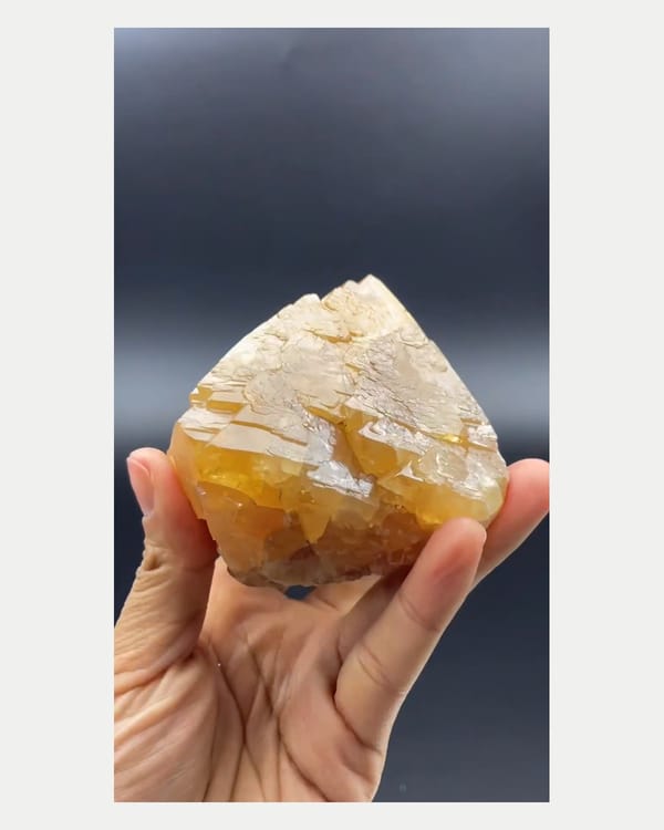 Complete right oblique view of large orange scheelite crystal