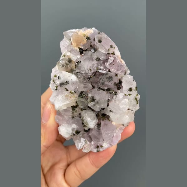 Lilac-white quartz cluster with dark epidote from Meigu, Sichuan — alternate view