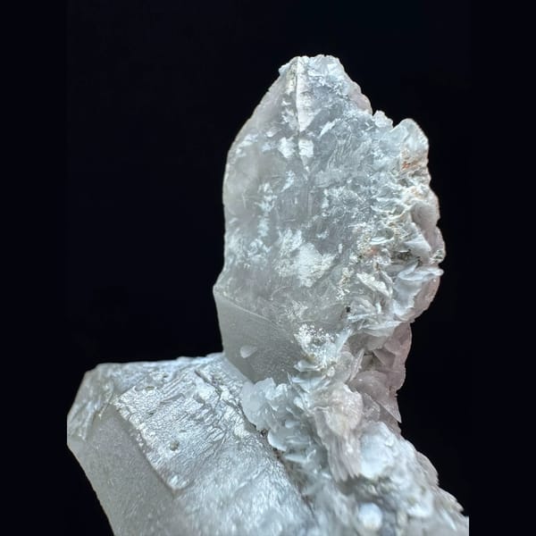 Crossed quartz floater with pale pink petal calcite from Inner Mongolia — detail view