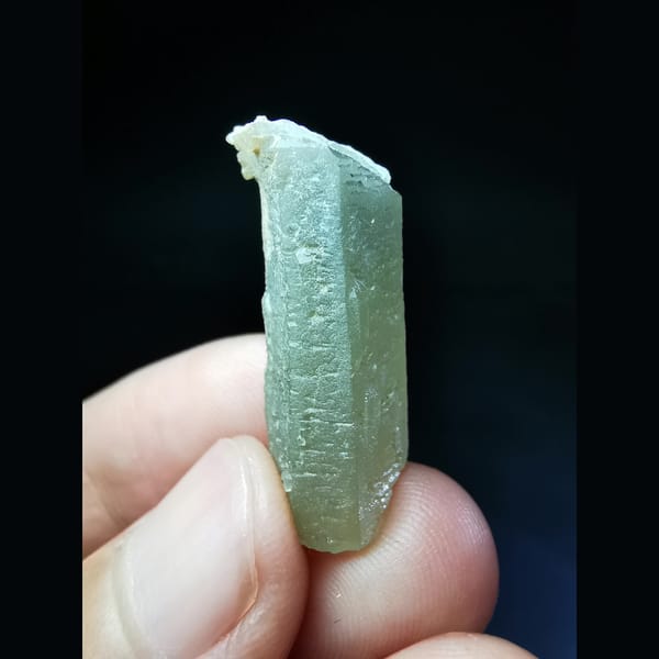 Green quartz crystal with a calcite-cut top — complete view