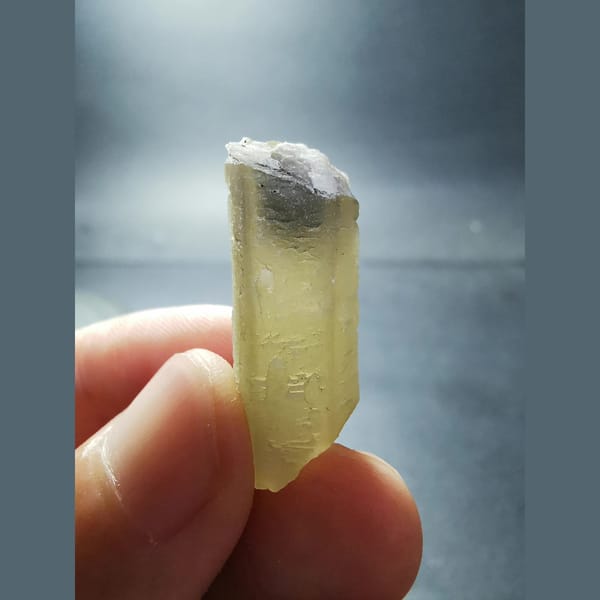 Green quartz crystal with a calcite-cut top — alternate view