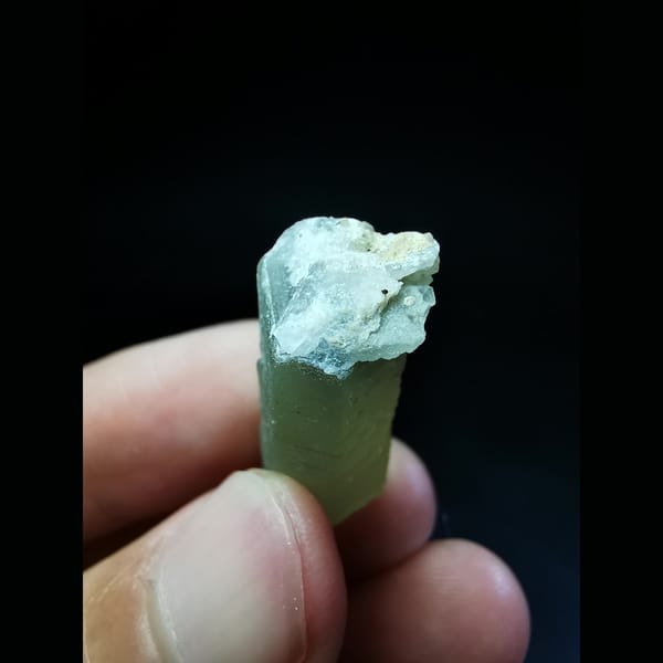 Green quartz crystal with a calcite-cut top — detail view