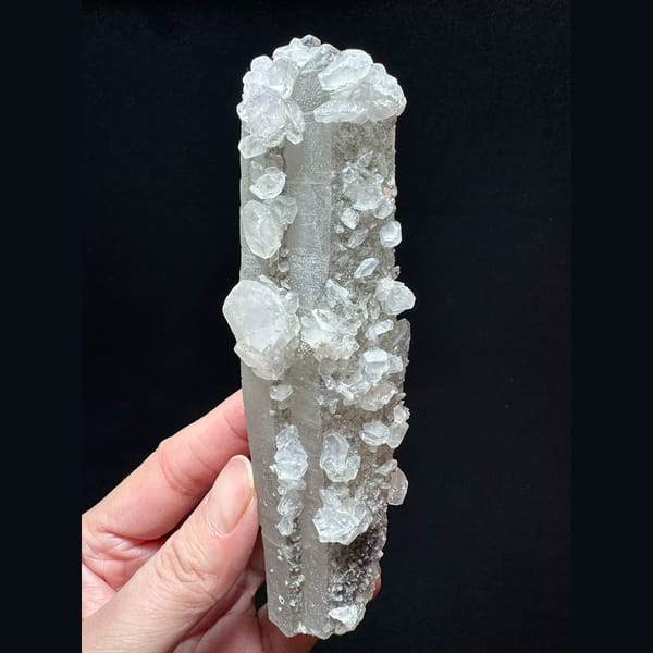 Tall sparkly quartz floater with petal calcite from Inner Mongolia — complete view