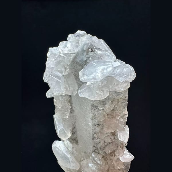 Tall sparkly quartz floater with petal calcite from Inner Mongolia — detail view