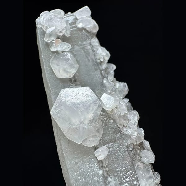 Tall sparkly quartz floater with petal calcite from Inner Mongolia — detail view
