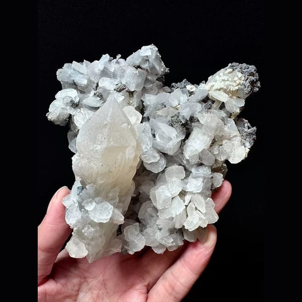 Large sparkly quartz floater with petal calcite and hematite from Inner Mongolia — complete view