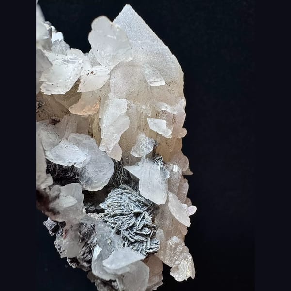 Large sparkly quartz floater with petal calcite and hematite from Inner Mongolia — alternate view