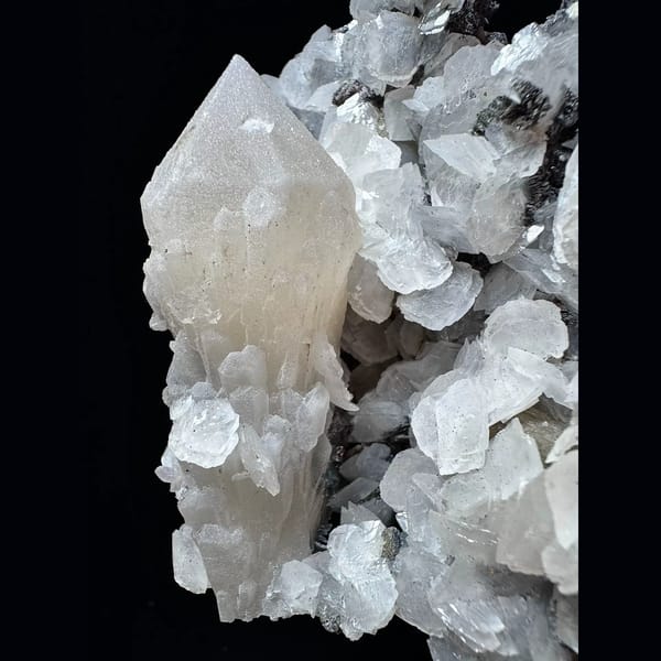 Large sparkly quartz floater with petal calcite and hematite from Inner Mongolia — detail view