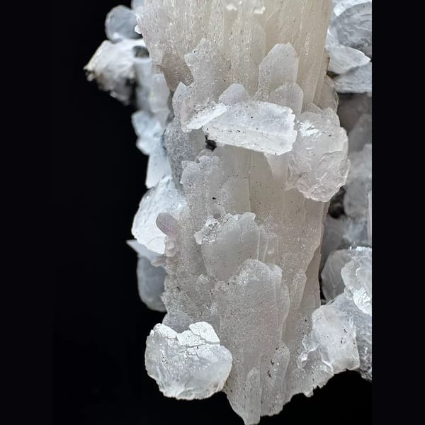 Large sparkly quartz floater with petal calcite and hematite from Inner Mongolia — detail view