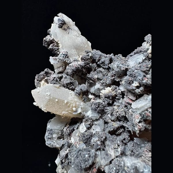 Large sparkly quartz floater with petal calcite and hematite from Inner Mongolia — detail view