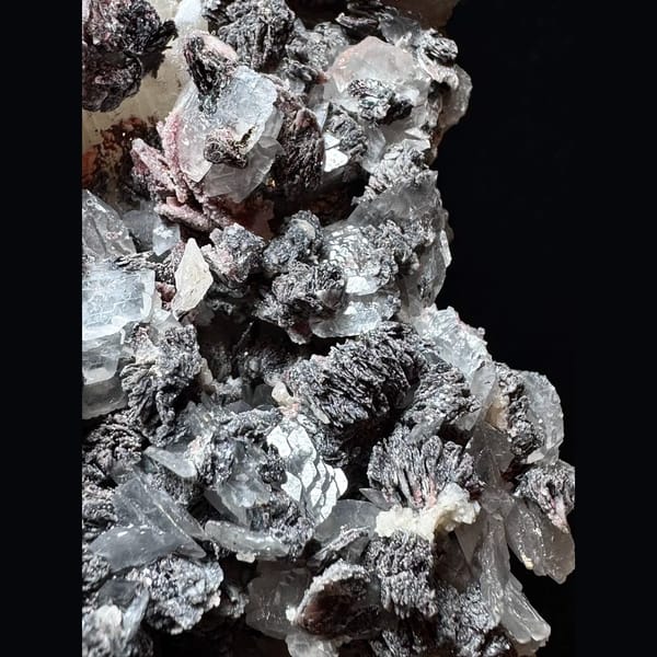 Large sparkly quartz floater with petal calcite and hematite from Inner Mongolia — detail view