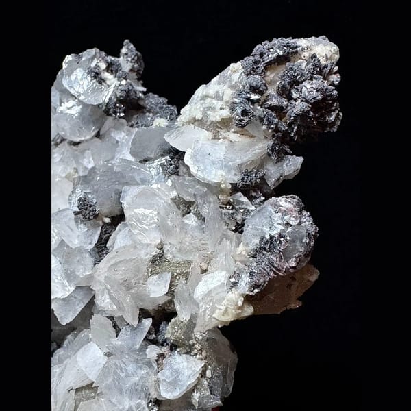 Large sparkly quartz floater with petal calcite and hematite from Inner Mongolia — detail view