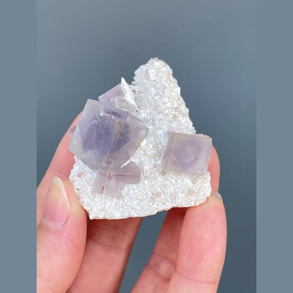 Lilac-purple fluorite cubes on white matrix from Yaogangxian — complete view