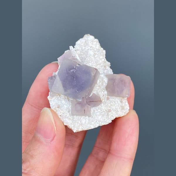 Lilac-purple fluorite cubes on white matrix from Yaogangxian — alternate view