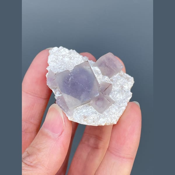 Lilac-purple fluorite cubes on white matrix from Yaogangxian — alternate view
