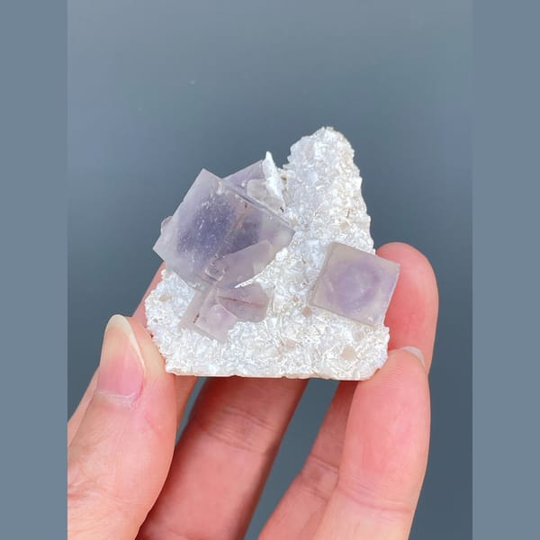 Lilac-purple fluorite cubes on white matrix from Yaogangxian — detail view