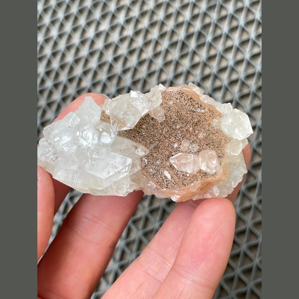Clear apophyllite with peach stilbite from India — complete view