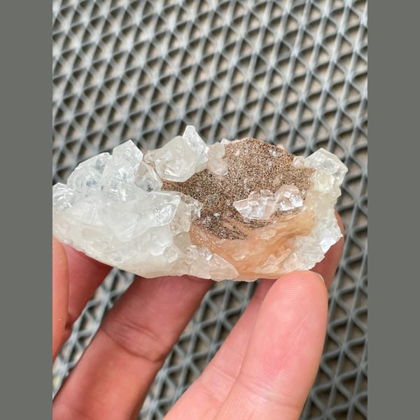 Clear apophyllite with peach stilbite from India — alternate view
