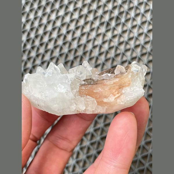 Clear apophyllite with peach stilbite from India — alternate view