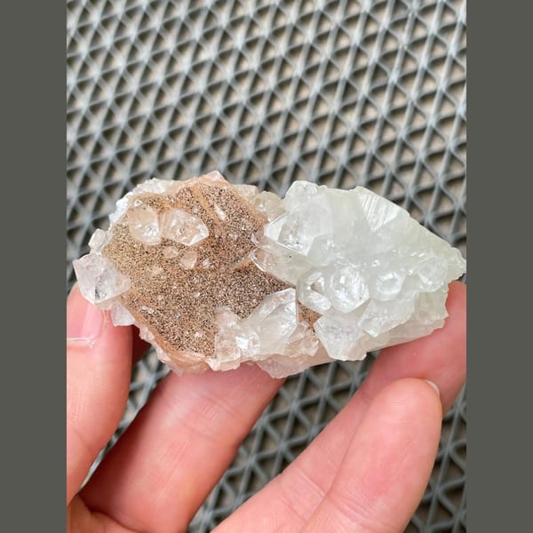 Clear apophyllite with peach stilbite from India — detail view