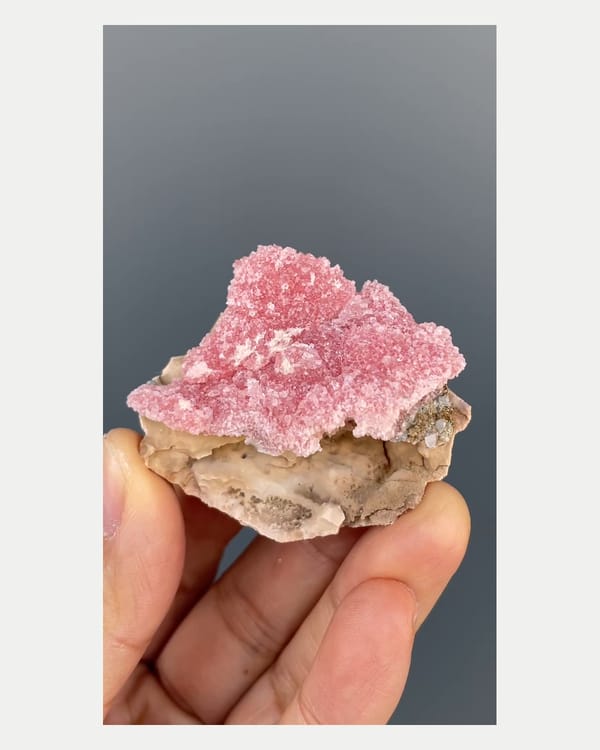 Complete front view of pink rhodochrosite specimen