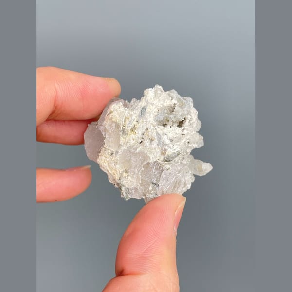 Glassy colourless fluorite with quartz from Inner Mongolia — detail view