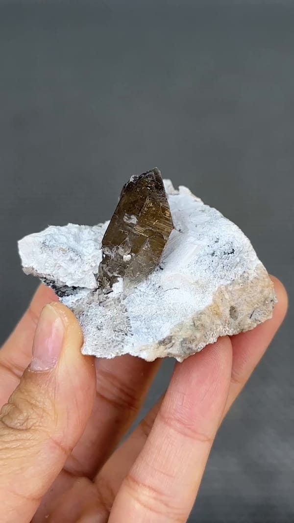 Complete ordinary-light front view of smoky quartz with supplier-identified hyalite from Yunxiao