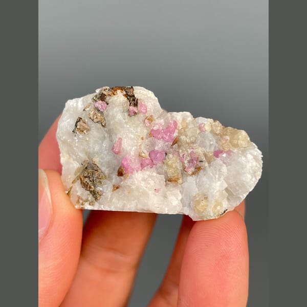 Pink-red corundum in white marble from Yunnan — complete view